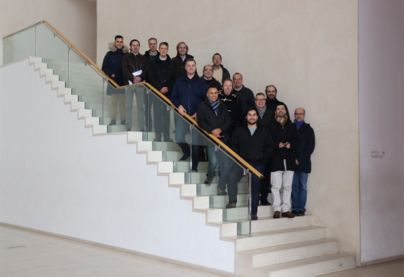 Participants of the event standing on stairs
