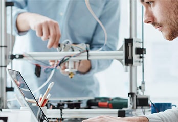 Students with technical equipment and PC