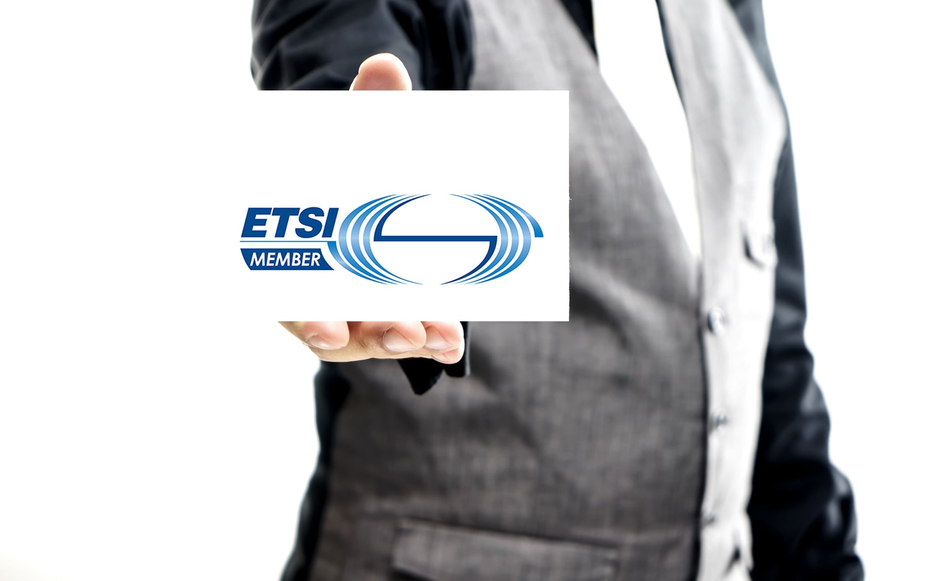 hand holding card with ETSI member written on it