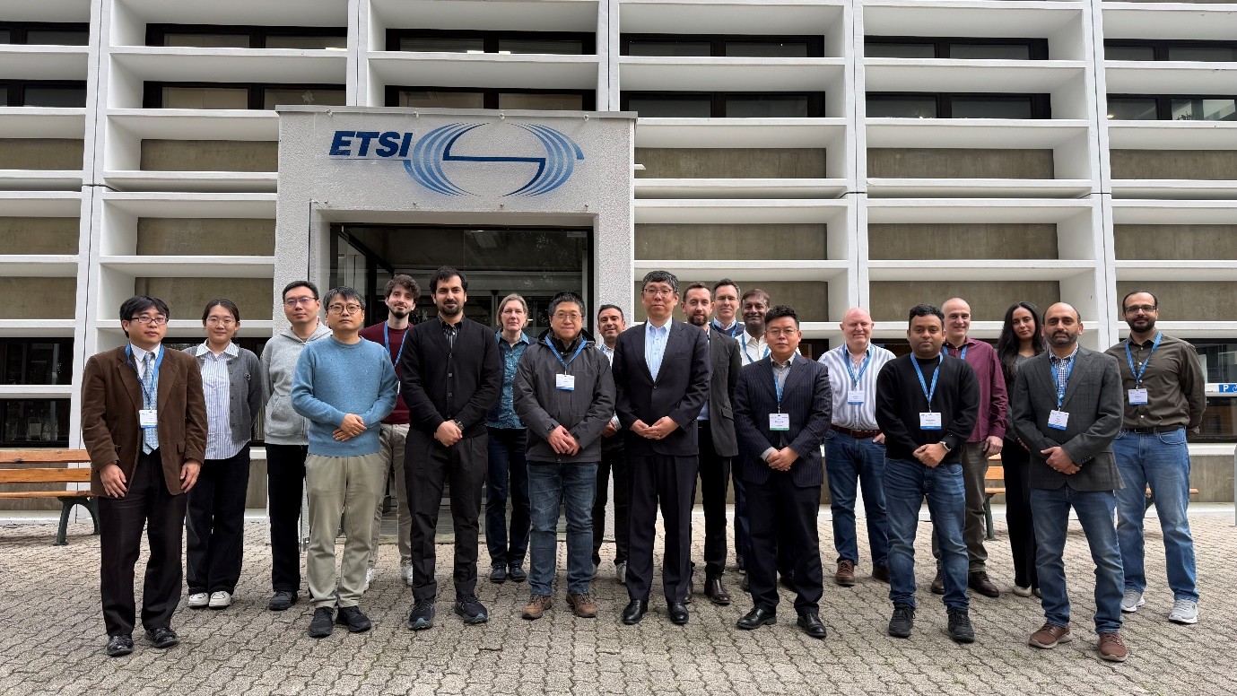 Group photo of NFV#53 conference participants standing in front of the ETSI headquarters building