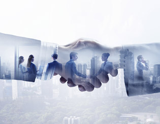 photo illustrating a business partnership with a handshake