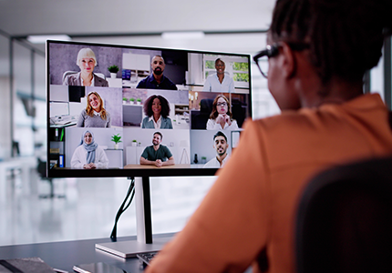 Woman looking at her screen in a virtual meeting