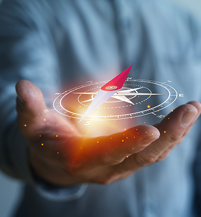 Close-up of a businessperson holding a glowing virtual compass interface
