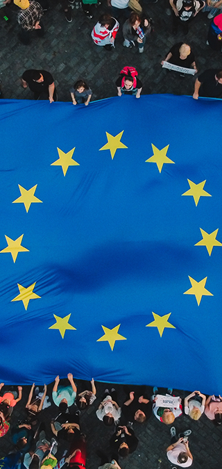 European flag held by a group of people