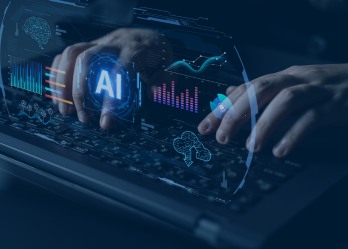 “Person typing on laptop with digital artificial intelligence dashboard and data visualisations overlay